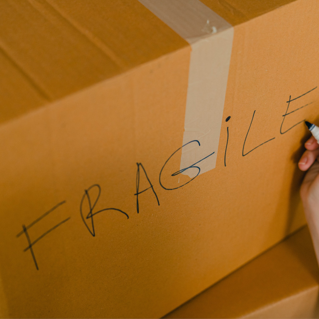 Box labeled fragile showing how Just Move provide a full packing service.
